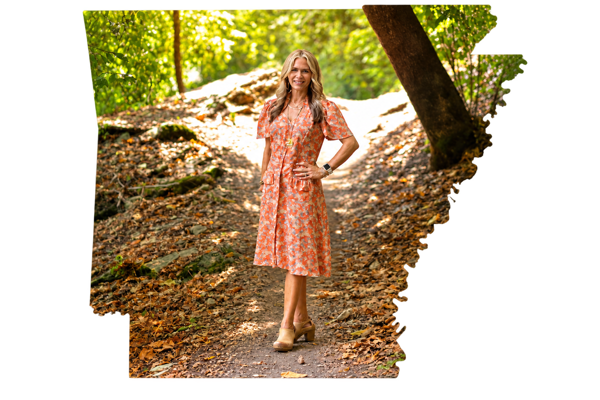 Nancy Orum on a Bella Vista trail, framed in the shape of Arkansas